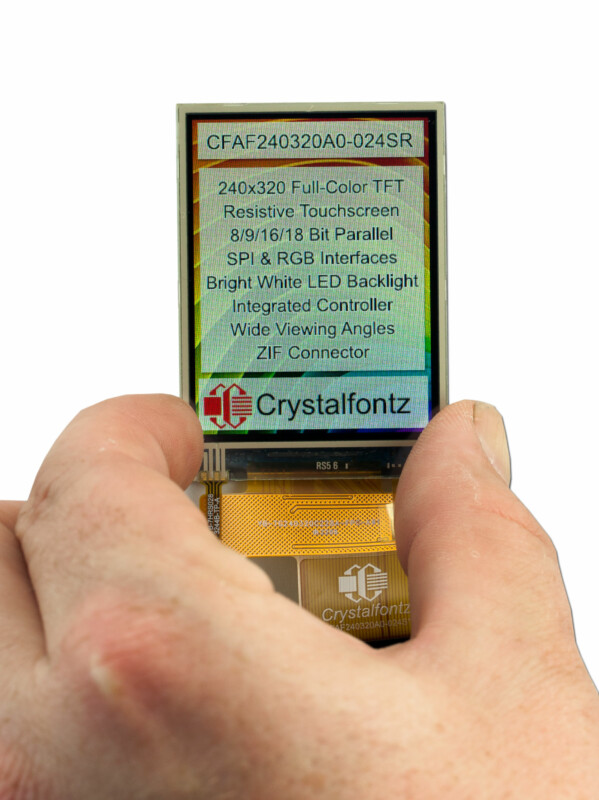 Display shown with hand for scale. Display has text that says "CFAF240320A0-024SR 240x320 Full-color TFT Resistive Touchscreen 8/9/16/18 Bit Parallel SPI & RGB interfaces Bright white LED backlight Integrated Controller wide viewing angles ZIF Connector Crystalfontz"