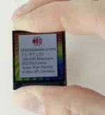 240x240 1.3-inch TFT mounted on a carrier board. Shown in hand to demonstrate size and perspective.