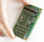 240x400 16-bit paralell TFT LCD on a carrier board. In hand to show perspective.