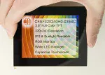 3.5 240x320 Capacitive Touchscreen TFT Display Module, front view, powered on, in hand to show size and perspective.