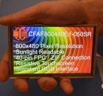 800x480 Resistive Touchscreen TFT Display, in hand to show size and perspective, display powered on.