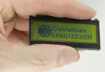 122x32 pixel reflective graphic LCD. In hand to show size and perspective.