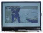240x128 Graphic LCD with breakout board. Front view, showing 4-layer grayscale image.