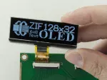 2.2-inch, 128x32 pixel graphic OLED.
Front view, in hand to show size and perspective.