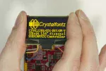 1.54 Yellow Monochrome OLED Development Kit, in hand to show size and perspective.