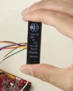 32x128 in-cell OLED display with breakout board. In -hand to show size and perspective.