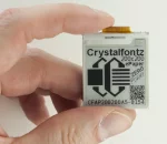 200x200 ePaper display module with a breakout board. in-hand to show size and perspective.