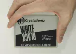 4.2 Black and white ePaper display, in hand to show size and perspective.