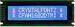 White on blue 16x2 character LCD. Sitronix ST7066U integrated controller. CFAH1602D-TMI-ET