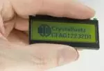122x32 pixel reflective graphic LCD. In hand to show size and perspective.