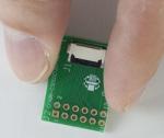 12-position ZIF breakout board. In hand to show size and perspective. 12-position ZIF breakout board. In hand to show size and perspective.