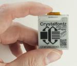 200x200 ePaper display module with a breakout board. in-hand to show size and perspective.