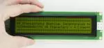 Large 40x4 Chararcter LCD display, front view, in hand to show size and perspective powered on.