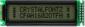 The CFAH1602O-TFH-ET is a dark on light gray character LCD display module ‒ front view, power off is still readable.