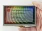 800x480 Ressitive Touchscreen TFT display module, front view, in hand to show size and perspective.