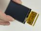 240x320 2.4 inch TFT LCD pictured in hand for perspective
