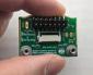 Carrier Board for 128x64 LCD Module, in hand to show size and perspective.
