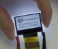 128x64 Monochrome, sunlight readable LCD display, front view, in -hand to show perspective.