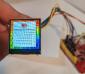 240x240 1.3 inch TFT development kit, with adapter board and micro-processor. in-hand to show size and perspective.