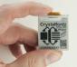200x200 ePaper display module with a breakout board. in-hand to show size and perspective.