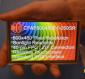 800x480 Resistive Touchscreen TFT Display, in hand to show size and perspective, display powered on.