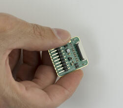 ePaper adapter in-hand to show perspective.