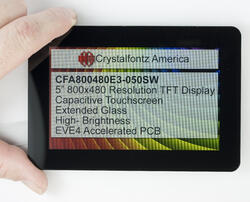 800x480 Wide Bezel Eve Powered TFT Display, front view in hand to show size and perspective.