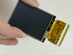 240x320 2.4 inch TFT LCD pictured in hand for perspective