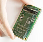 240x400 16-bit paralell TFT LCD on a carrier board. In hand to show perspective.