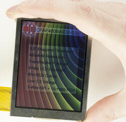 480x640 Transflective TFT Display, Front view, powered on, in hand to show perspective.