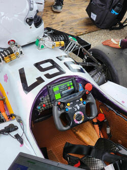 800x480 Sunlight Readable TFT Display, front view powered on and being used for a race car instrument panel.