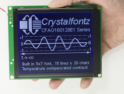 160x128 Graphic Monochrome LCD with negative voltage generator and temperature compensation. In-hand to show size and perspective.