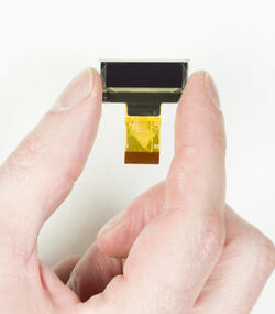 CFAL12836AO-088 128x36 Small OLED display, front view in hand.