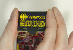 128x64 Yellow OLED, Front View in hand to show size and perspective.
