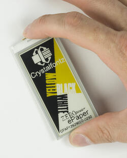 128x296 pixel ePaper display module, in-hand to show perspective.